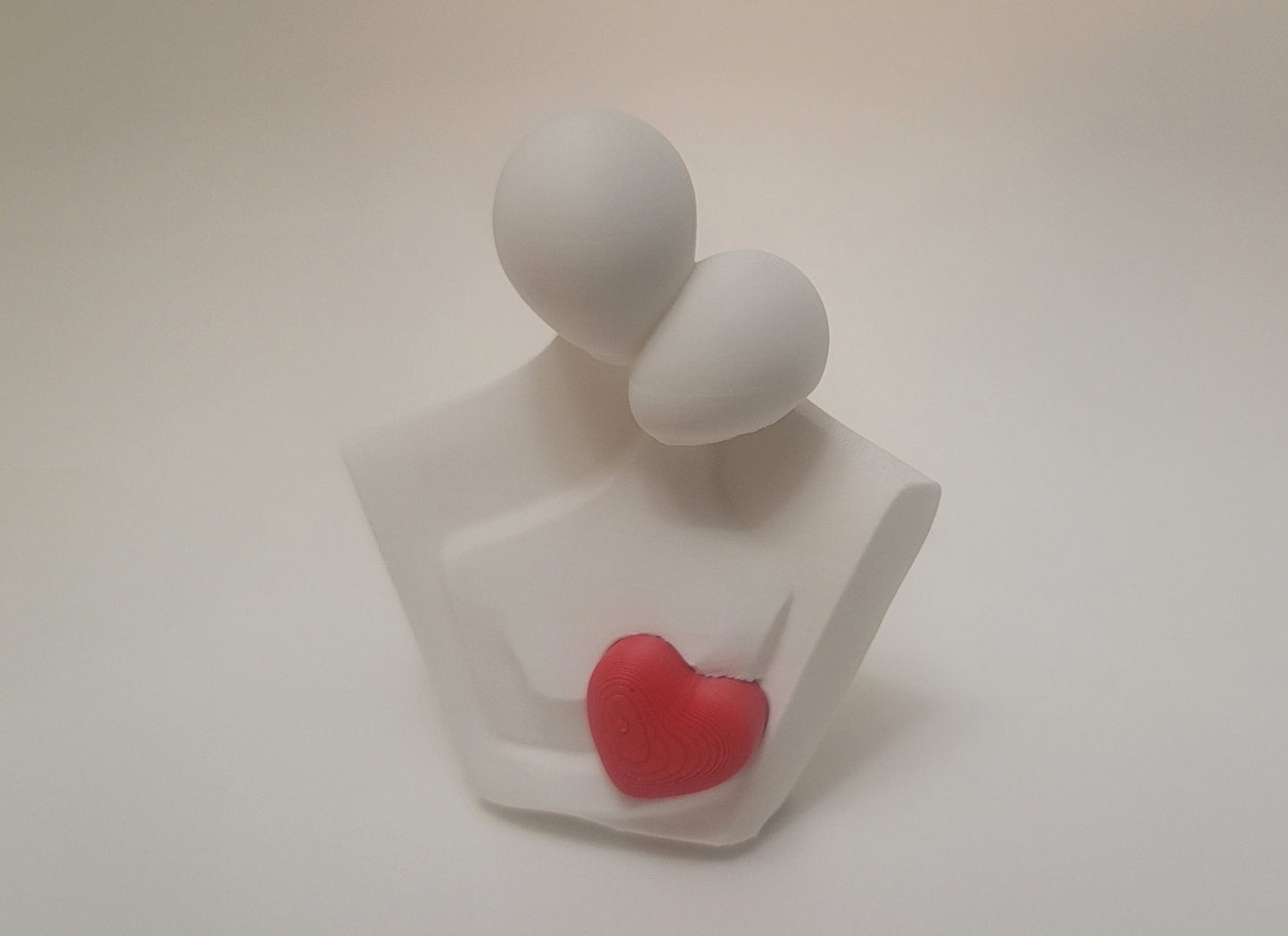 3D printed couple figurine with red heart, approximately 3 inches tall, handmade in Reno NV by Woody Burns Home Creations