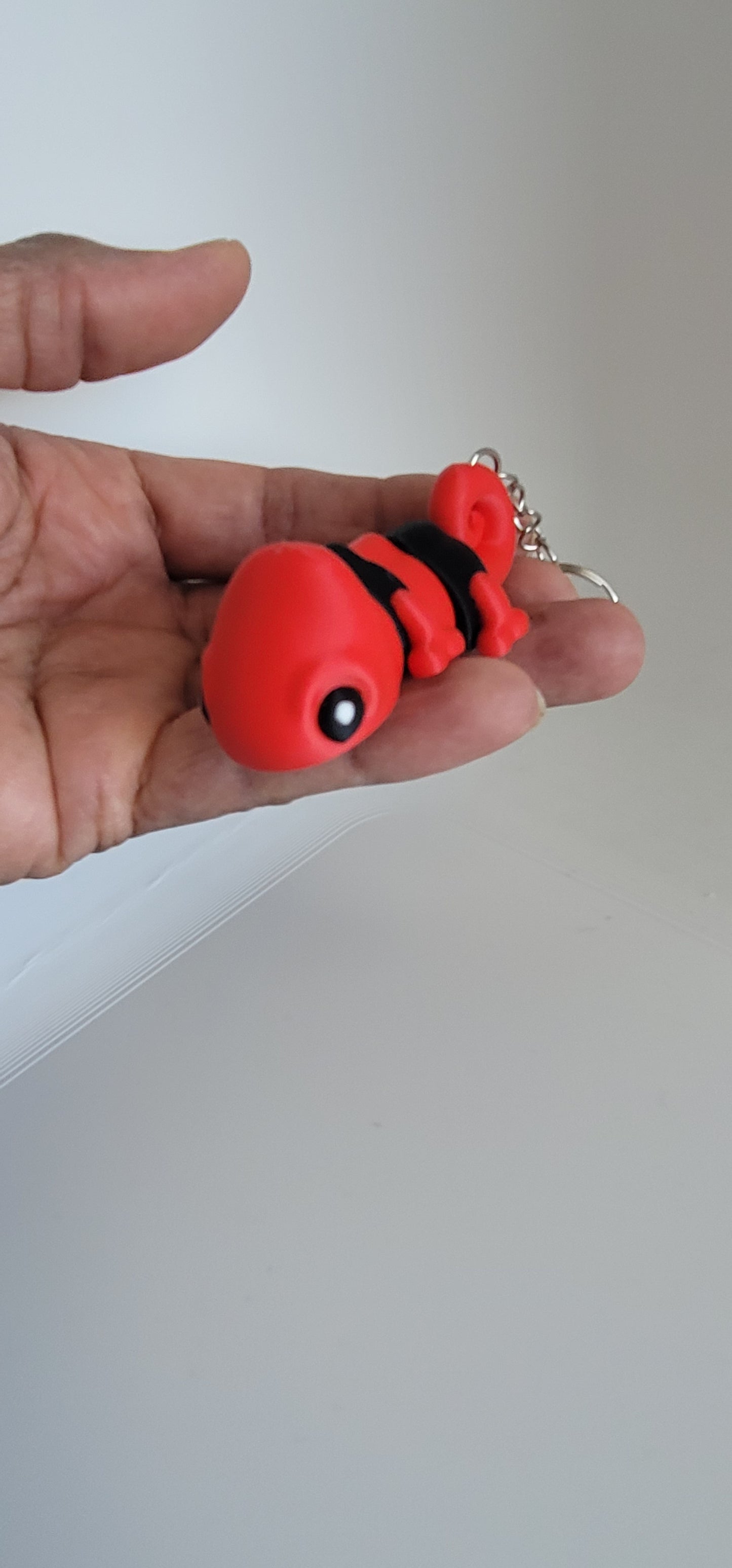 Flexi chameleon keychain showing articulated tail and legs, 3D printed fidget toy Reno NV