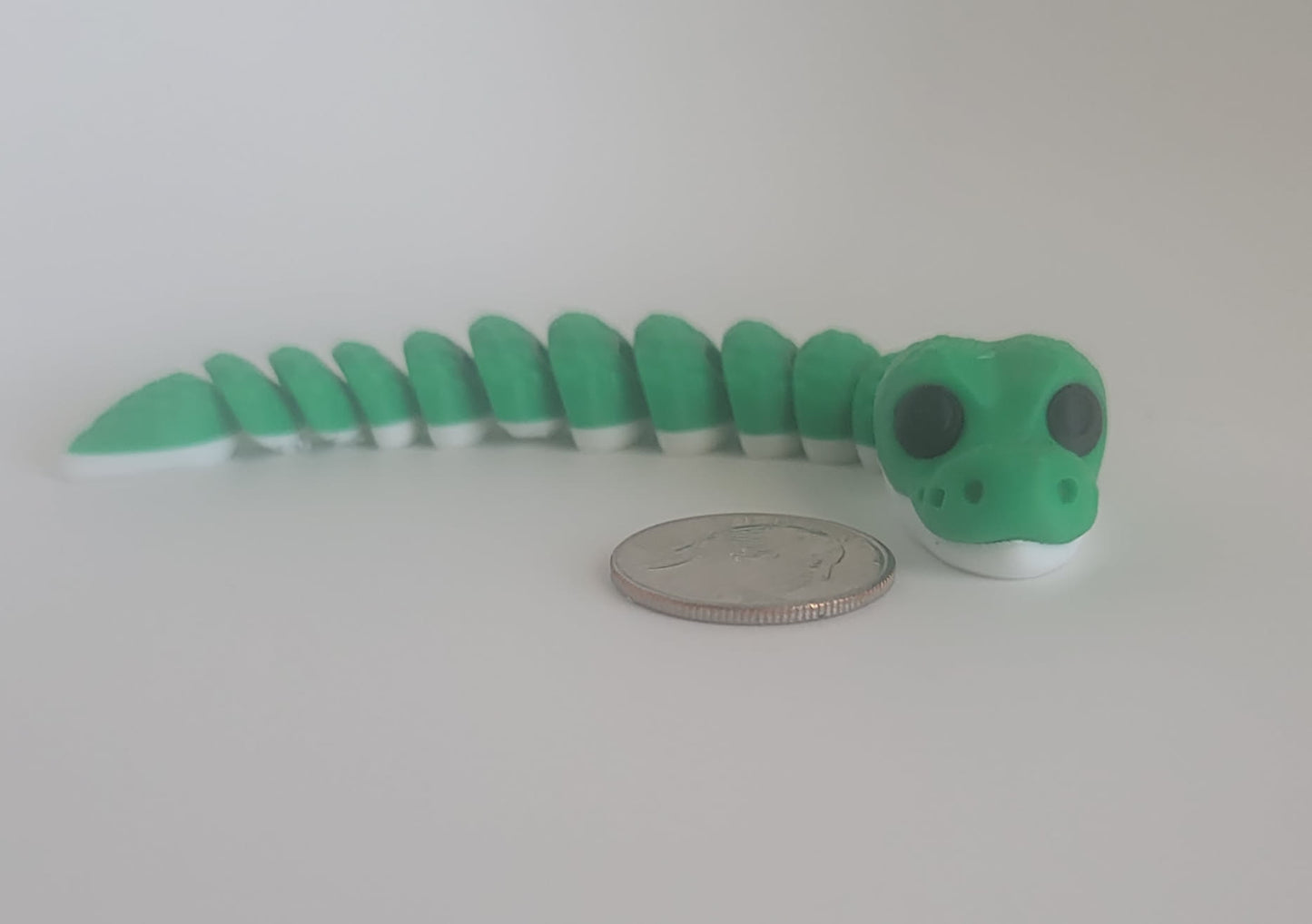 3D printed flexi snake keychain with quarter for scale, green reptile fidget toy Reno NV