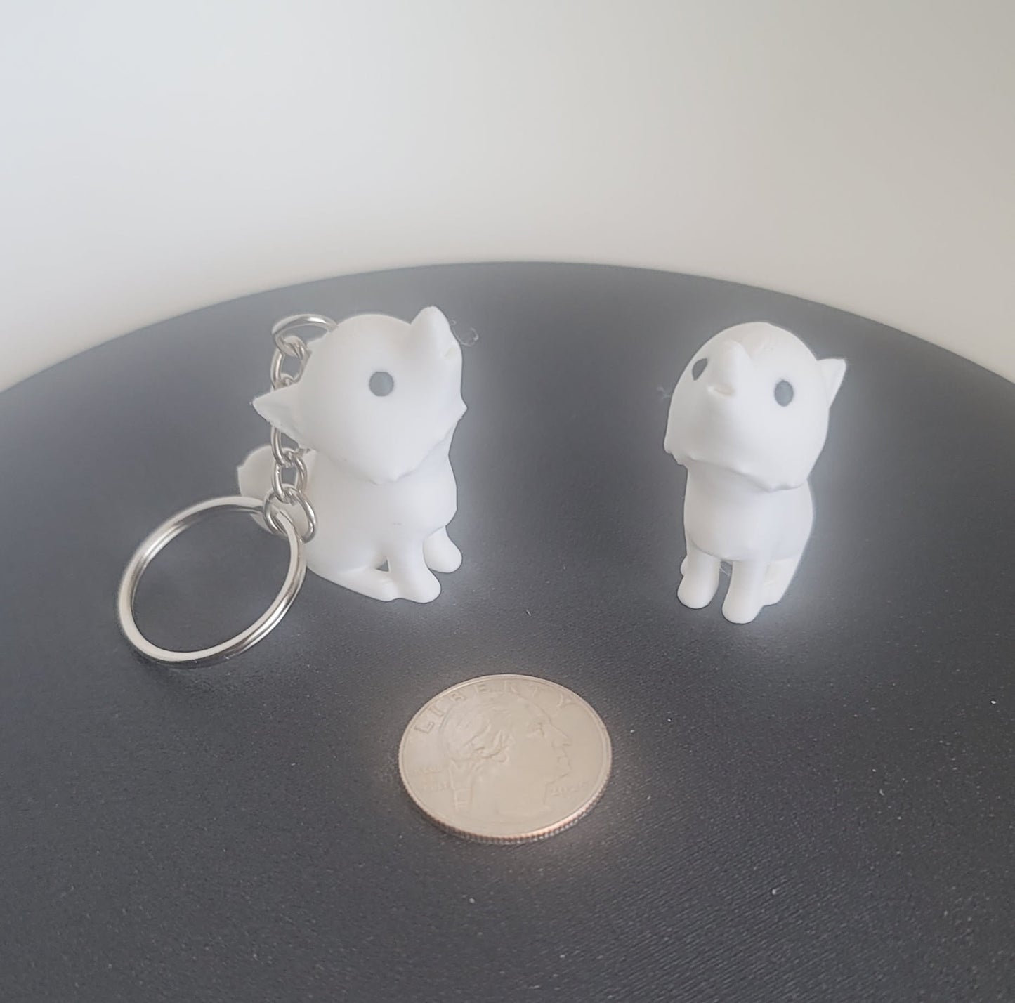 3D printed white dire wolf keychain top angle, solid one-piece fantasy figurine, Reno NV