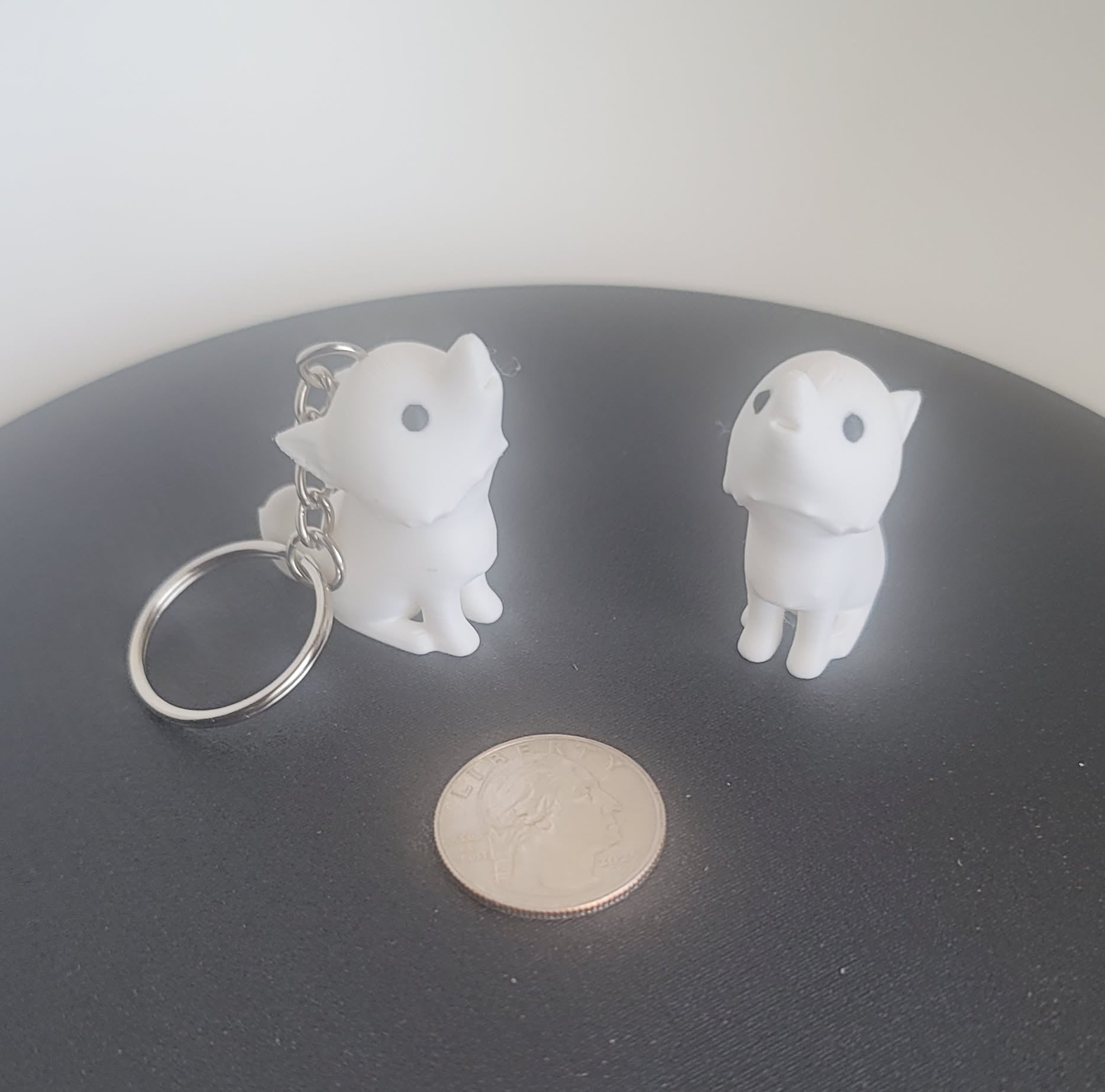 3D printed white dire wolf keychain top angle, solid one-piece fantasy figurine, Reno NV