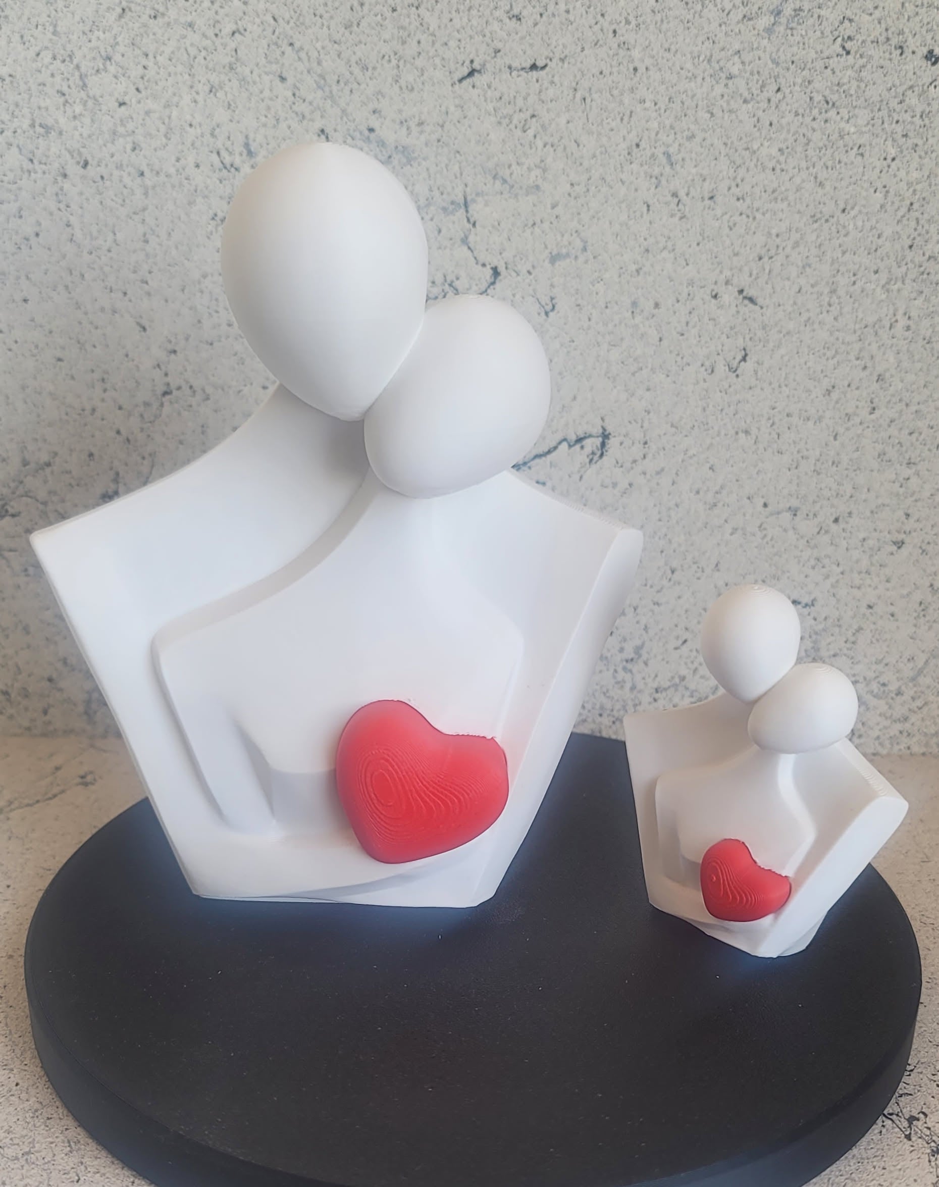 3D printed couple figurine with red heart shown in both sizes — Standard (3") and Large (6") — handmade in Reno NV by Woody Burns Home Creations